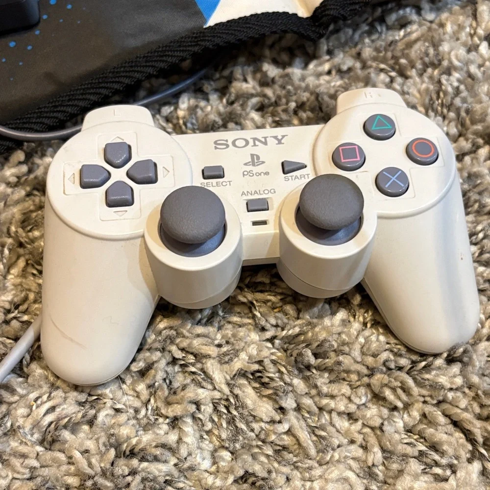 Sony PlayStation Console with White and Gray Design (everything included)